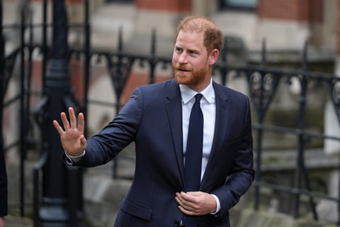 Britain's Prince Harry waves as he arrives at London's High Court to lead a group, including Elton John and Elizabeth Hurley, accusing the Daily Mail's publisher of privacy invasion through unlawful tactics in a trial that is part of a wider phone hacking scandal in London, Monday, Jan. 19, 2026. 