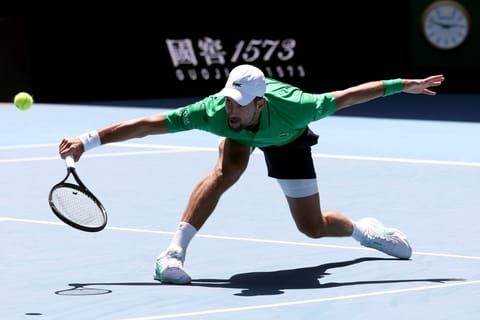 Serbia’s Novak Djokovic hits a return to Italy’s Francesco Maestrelli during their men’s singles match on Day 5 of the Australian Open tennis tournament in Melbourne on January 22, 2026.