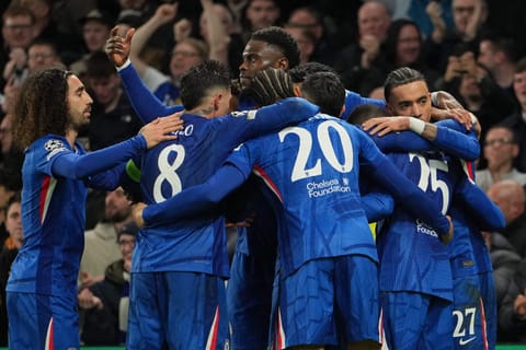 Chelsea players celebrate after scoring during the Champions League