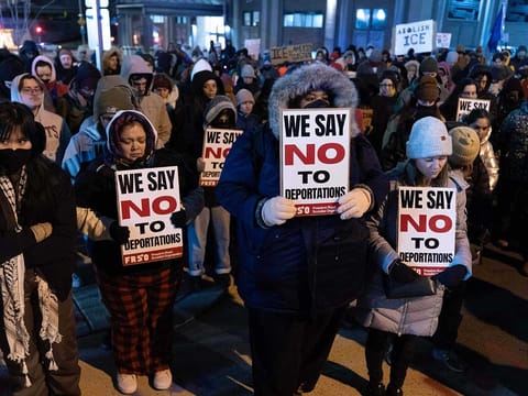 Demonstrators hold a moment of silence for Alex Jeffrey Pretti, the man killed by a federal immigration officer in Minneapolis, during a rally outside of U.S. Immigration and Customs Enforcement headquarters in Washington.