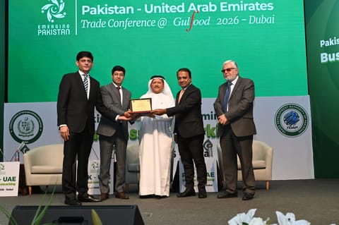 Dr Mohammed Saeed Al Kindi, former UAE Minister of Water and Environment receiving shield from Hussain Muhammed; Ali Khan and Athar Hussain Khokhar at the event in Dubai