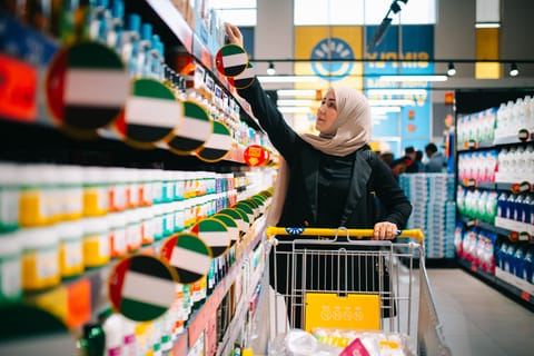 A shopper browses the aisles at a Sava discount store in the UAE.
