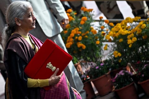 India's Finance Minister Nirmala Sitharaman leaves the Finance Ministry office to present the annual budget to the parliament at the Kartavya Bhawan in New Delhi on February 1, 2026.