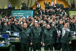 In this handout picture provided by Ithe Islamic Consultative Assembly News Agency (ICANA), members of Iran's parliament dressed in IRGC uniforms, chant "Death to America" during a session in Tehran on February 1, 2026,
