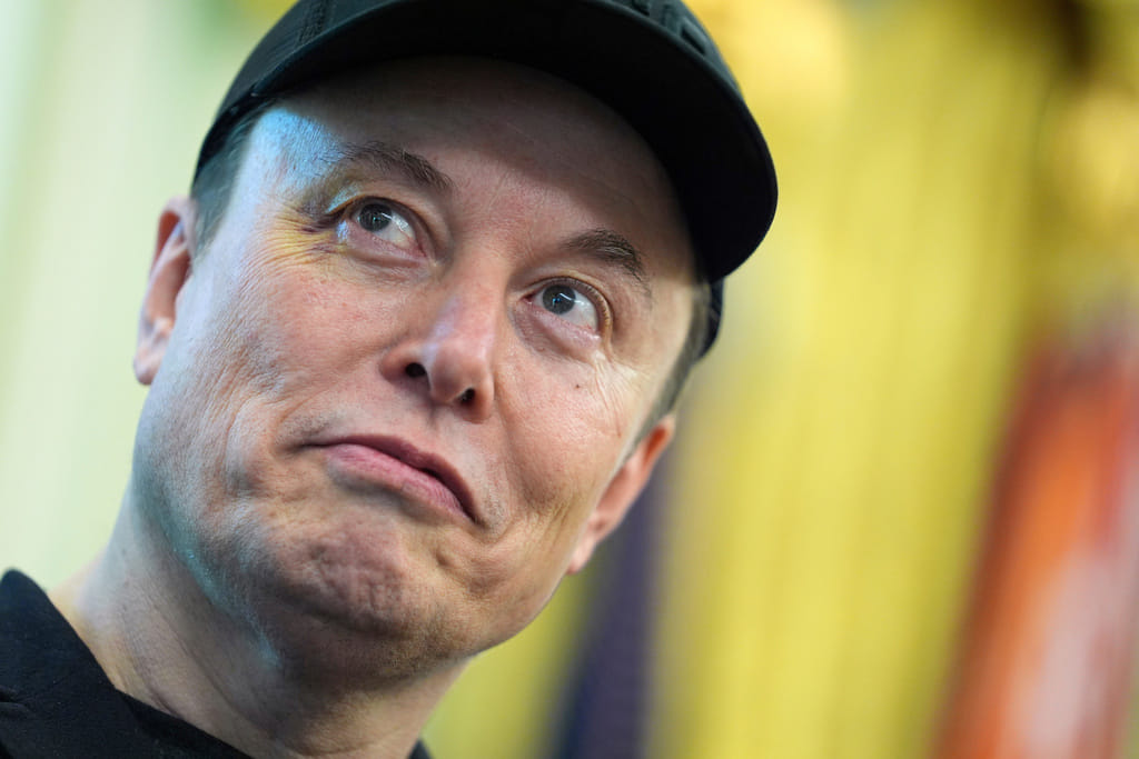 FILE - Elon Musk listens as President Donald Trump speaks during a news conference in the Oval Office of the White House, May 30, 2025, in Washington. (AP Photo/Evan Vucci, File)