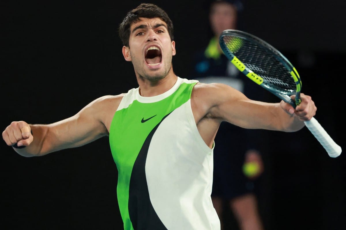 Spain's Carlos Alcaraz reacts after a point against Serbia's Novak Djokovic during their men's singles final match on day fifteen of the Australian Open tennis tournament in Melbourne on February 1, 2026.