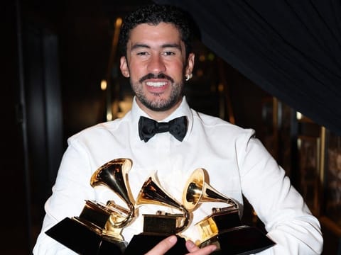 Bad Bunny poses with the Album of the Year, Best Música Urbana Album, and Best Global Music Performance Awards during the 68th GRAMMY Awards