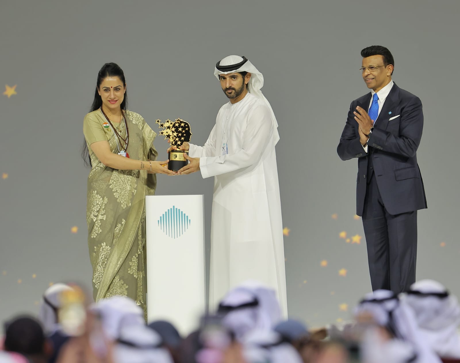 Indian teacher Rouble Nagi accepting the $1-million Global Teacher Prize from Dubai Crown Prince Sheikh Hamdan and GEMS Education founder Sunny Varkey at the World Governments Summit 2026.