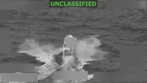 A screengrab from a Pentagon video shows an alleged drug-trafficking boat in the eastern Pacific Ocean before it was struck on Thursday, killing two people, according to US Southern Command. Death toll in Washington's campaign rises to at least 128 since it began in September