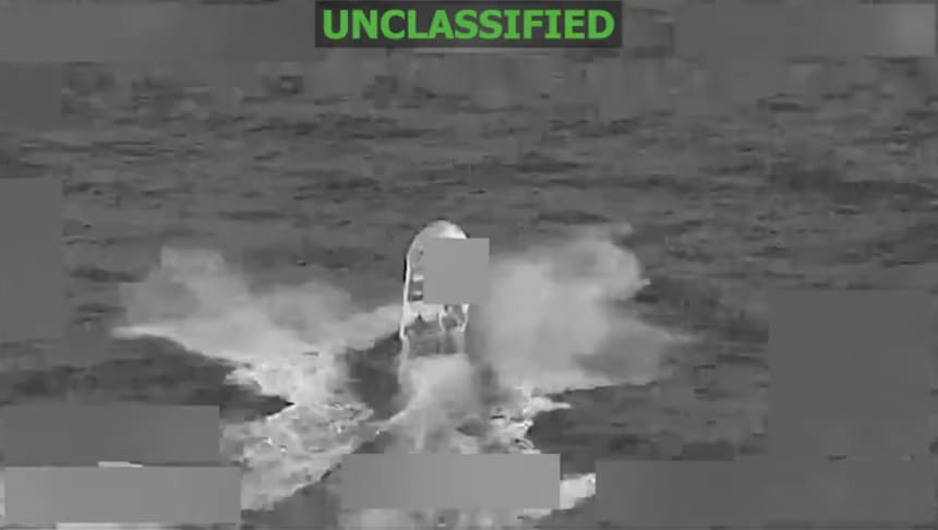 A screengrab from a Pentagon video shows an alleged drug-trafficking boat in the eastern Pacific Ocean before it was struck on Thursday, killing two people, according to US Southern Command. Death toll in Washington's campaign rises to at least 128 since it began in September