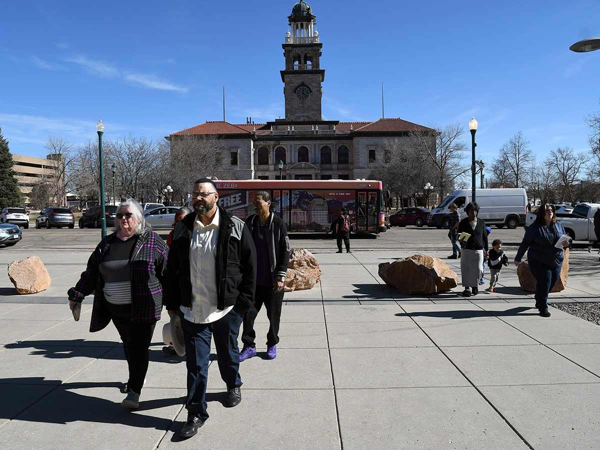 Derrick Johnson, whose mother's body was one of 189 left to decay in the Return to Nature Funeral Home in Penrose, Colorado, walks toward the El Paso County Courthouse for owner Jon Hallford's sentencing in Colorado Springs, on Friday, February 6, 2026.  