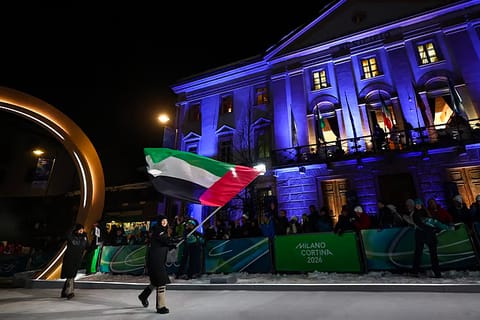 The UAE's flag bearer Piera Hudson during the opening ceremony of the Milano Cortina 2026 Winter Olympic Games in Cortina d'Ampezzo, northern Italy, on February 6, 2026.