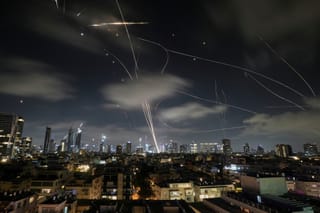 FILE - The Israeli Iron Dome air defense system intercepts missiles during an Iranian attack on Tel Aviv, Israel, June 18, 2025. (AP Photo/Leo Correa, File)