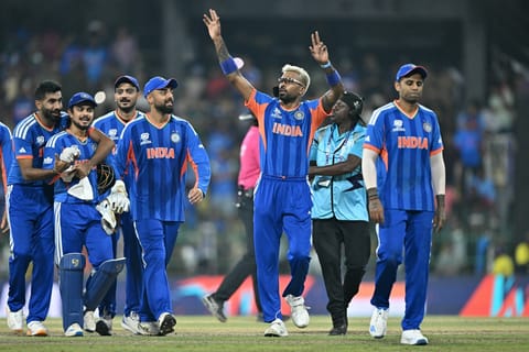 India's Jasprit Bumrah (L), Ishan Kishan, Axar Patel, Varun Chakravarthy, Hardik Pandya and captain Suryakumar Yadav celebrate their team's win against Pakistan at the end of the 2026 ICC Men's T20 Cricket World Cup group stage match in the R Premadasa Stadium in Colombo on February 15, 2026.
