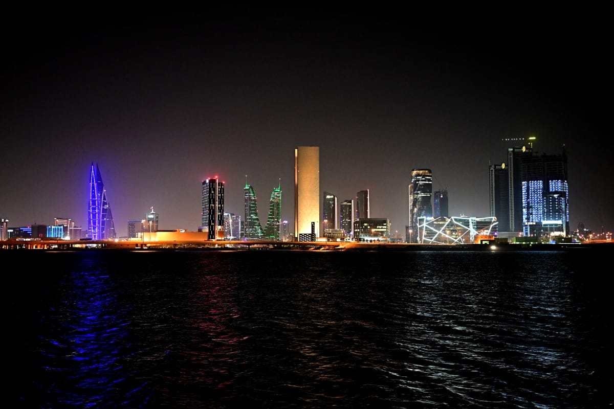 A picture taken on February 16, 2026, shows the skyline of the Bahraini capital Manama at night.