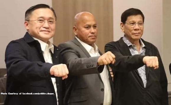 In July 2025, the Philippine House of Representatives adopted the report of the quad committee recommending the filing of criminal charges against former President Rodrigo Duterte (right), Senators Christopher Go (left) and Ronald Dela Rosa (centre), and several others in connection with the extrajudicial killings, illegal drug trade, and POGO operations.