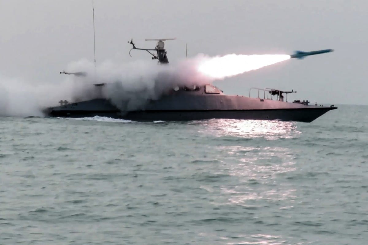 A boat firing a missile during a military exercise by members of the Iran's Revolutionary Guards Corps on February 16, 2026.