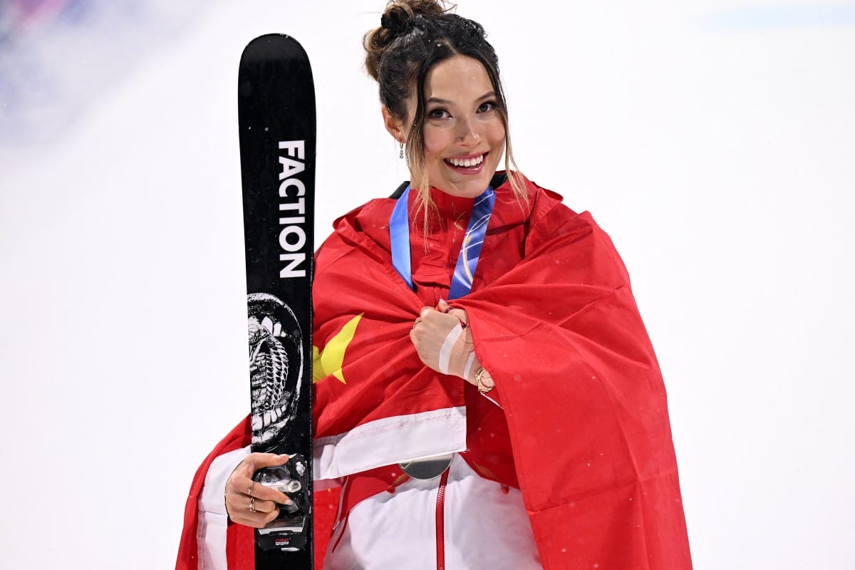 Silver medallist China's Eileen Gu celebrates on the podium after the freestyle skiing women's freeski big air final during the Milano Cortina 2026 Winter Olympic Games  2026.