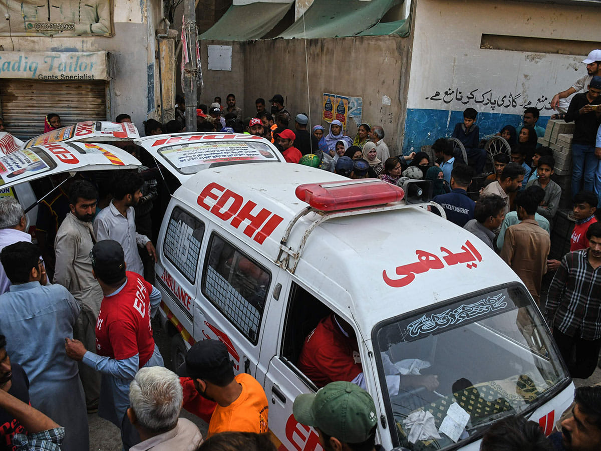 Rescue workers help in the operations following a gas explosion at an apartment building, in Karachi, Pakistan, Thursday, Feb. 19, 2026. 