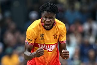 Zimbabwe's Blessing Muzarabani celebrates after taking the wicket of Sri Lanka's Kusal Perera during the 2026 ICC Men's T20 Cricket World Cup group stage match between Sri Lanka and Zimbabwe at the R Premadasa Stadium in Colombo on February 19, 2026.
