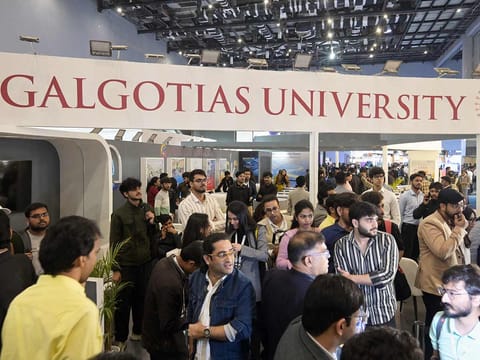 People visit Galgotias University stall at AI summit ahead of an eviction order issued by Indian authorities, in New Delhi, India, Wednesday, February 18, 2026. 
