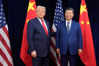 President Donald Trump, left, and Chinese President Xi Jinping pose ahead of their summit talk at Gimhae International Airport in Busan, South Korea, October 30, 2025.  Trump is scheduled to meet Xi in Beijing on May 14-15.