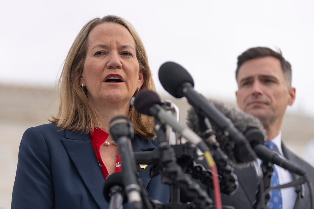 FILE - Arizona Attorney General Kris Mayes speaks to reporters as Oregon Attorney General Dan Rayfield listens outside the Supreme Court, on Nov. 5, 2025, in Washington. (AP Photo/Mark Schiefelbein, File)