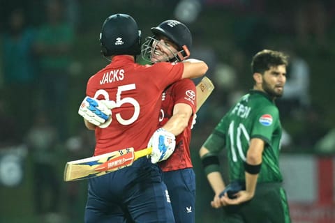 England captain Harry Brook (C) is congratulated by teammate Will Jacks (L) following his century (100 runs) during the 2026 ICC Men's T20 Cricket World Cup Super Eights match between England and Pakistan at the Pallekele International Cricket Stadium in Kandy on February 24, 2026.