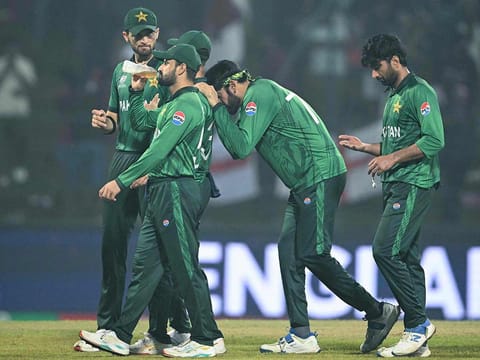 Pakistan players walk back after their defeat during the T20 World Cup Super Eights match against England at the Pallekele International Cricket Stadium in Kandy on February 24, 2026. 