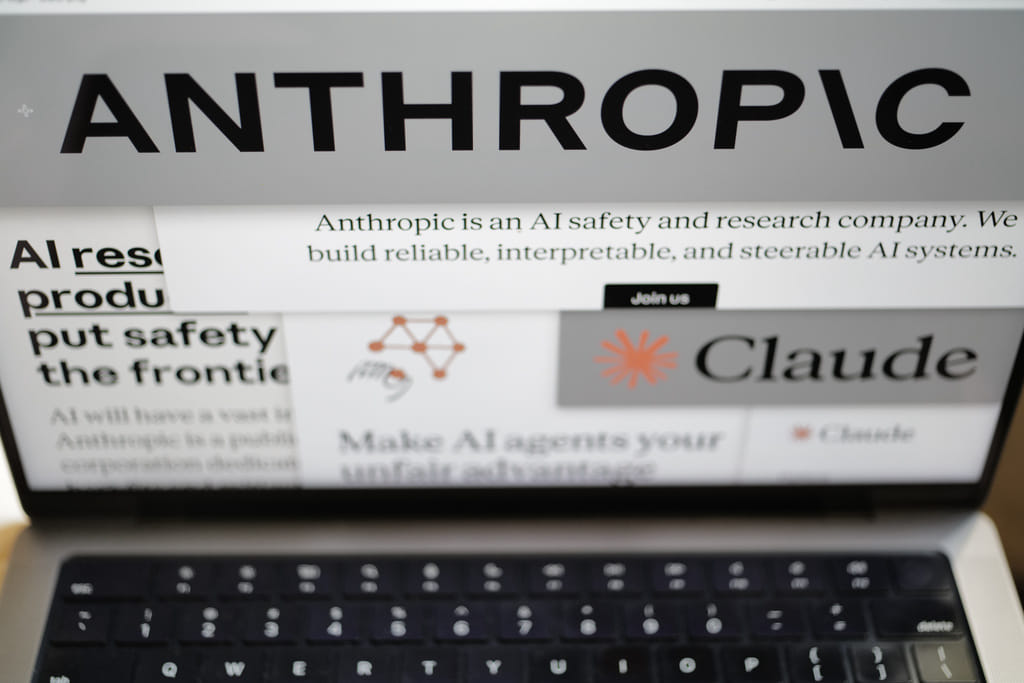 Pages from the Anthropic website and the company's logos are displayed on a computer screen in New York on Thursday, Feb. 26, 2026