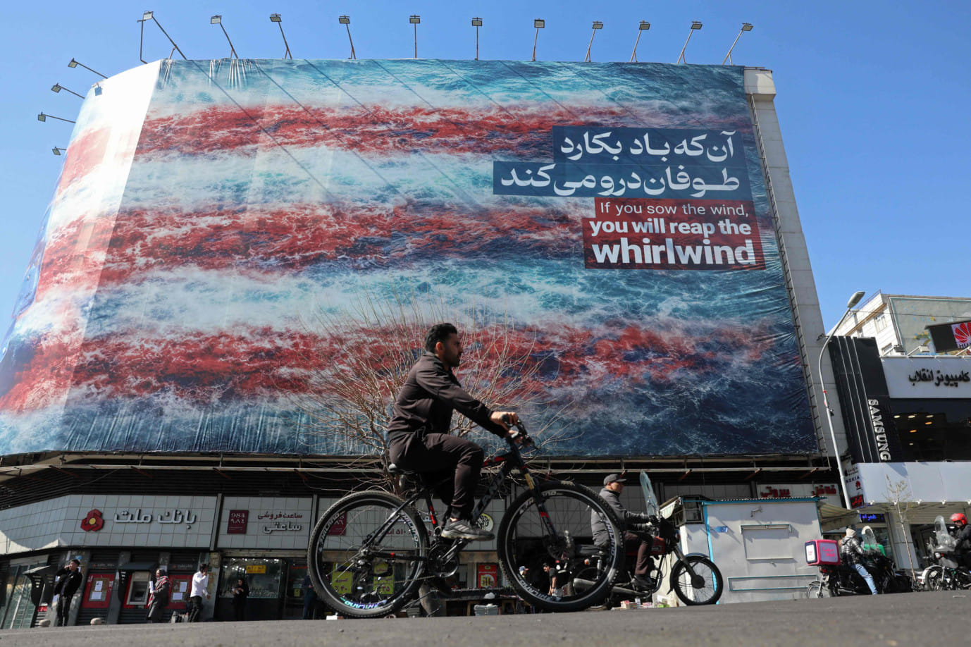 Aan anti-US billboard installed on a building along a street in Tehran on February 26, 2026.  