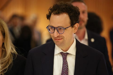 Anthropic CEO Dario Amodei looks on after a meeting with French President Emmanuel Macron during the AI Impact Summit in New Delhi on February 19, 2026.