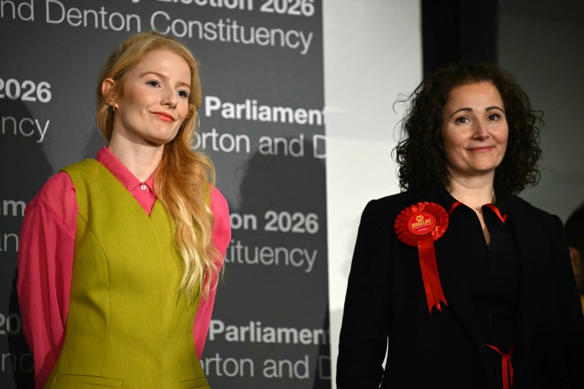 Green Party candidate Hannah Spencer (L) stands alongside Labour party candidate Angeliki Stogia as she is announced as the winner of the Gorton and Denton Parliamentary by-election, at Manchester Central Convention Complex in Manchester, northern England on February 27, 2026.