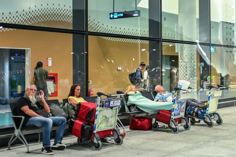 Stranded passengers wait at Velana International Airport in Male after several flights to Middle East destinations were cancelled.
