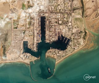 This handout satellite image taken by 2026 Planet Labs PBC shows damage at the military harbour in Iran's southern port of Bandar Abbas along the Strait of Hormuz on March 4, 2026.