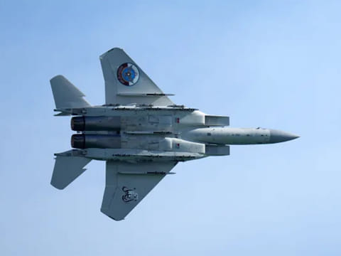 A Qatar Emiri Air Force F-15 Eagle tactical fighter aircraft performs aerial maneuvers in the sky above Doha as Qatar marked its National Day on December 18, 2021.
