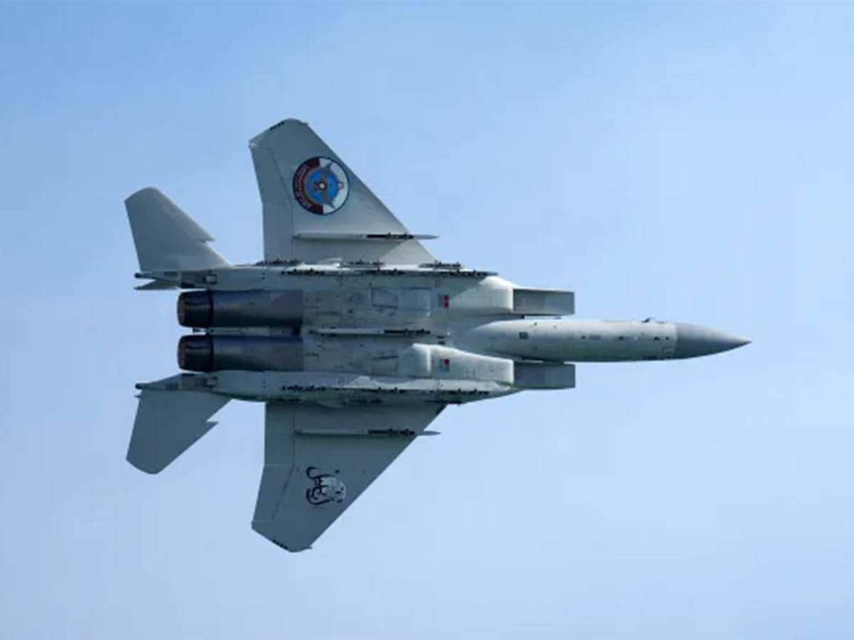 A Qatar Emiri Air Force F-15 Eagle tactical fighter aircraft performs aerial maneuvers in the sky above Doha as Qatar marked its National Day on December 18, 2021.
