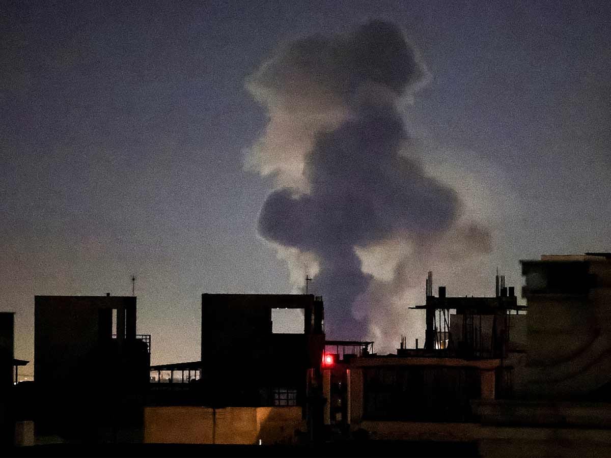 A plume of smoke rises after a strike on Tehran on March 4, 2026. 