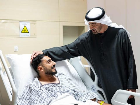 UAE President His Highness Sheikh Mohamed bin Zayed Al Nahyan visits an injured patient receiving treatment at the Sheikh Shakhbout Medical City in Abu Dhabi. 