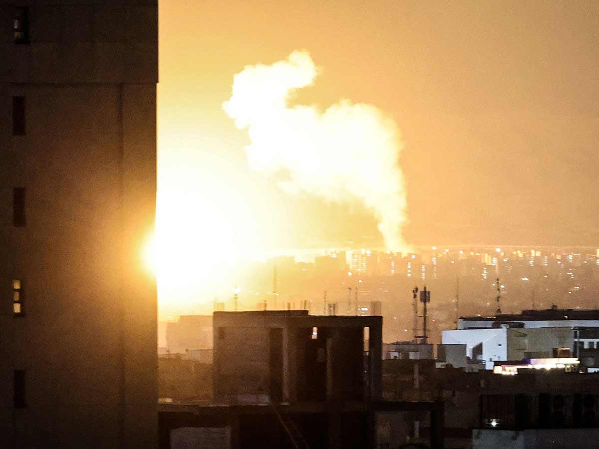 Smoke and fire rise from the site of airstrikes in a central area of the Iranian capital Tehran 