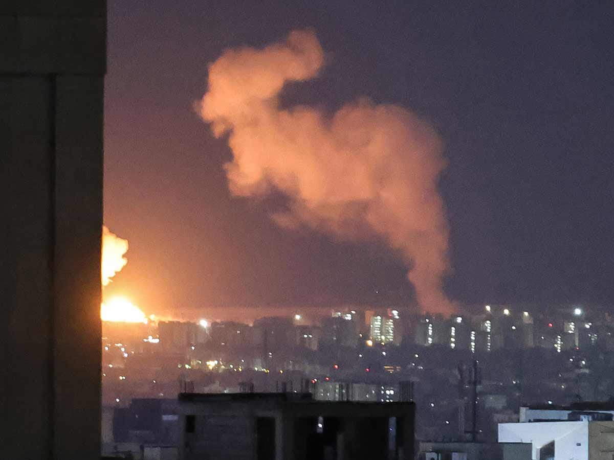 Smoke and fire rise from the site of airstrikes in a central area of the Iranian capital Tehran on March 6, 2026. 