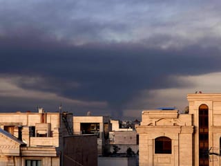 Smoke rises from the site of airstrikes in Tehran 