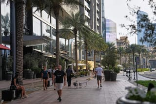Private sector employees should receive their salaries on the first day of every month. Dubai residents near Dubai Mall. Image used for illustrative purposes. 
