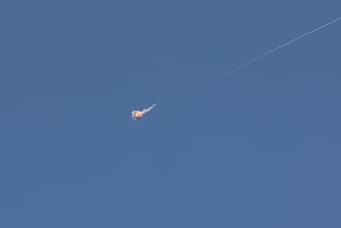 Rocket trails are seen in the sky above the Israeli coastal city of Tel Aviv amid a fresh barrage of Iranian missile attacks. File photo taken on March 9, 2026.