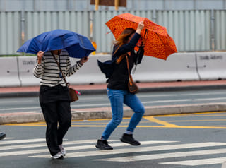 Residents caught in the rain in Dubai