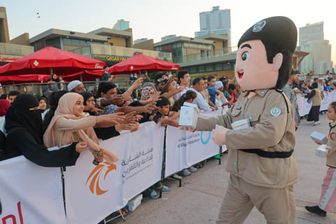 Volunteers and Sharjah Police mascots distribute Iftar meal packets to the public ahead of the Ramadan cannon firing at Al Majaz Waterfront. Every year during the holy month, authorities and volunteers across the UAE distribute thousands of meals to commuters and residents under initiatives such as the Safer Ramadan campaign, promoting generosity, community care and road safety at Iftar time.