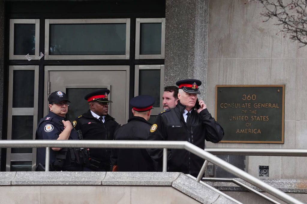 Toronto police officers investigate outside the U.S. consulate in Toronto on Tuesday March 10, 2026.  