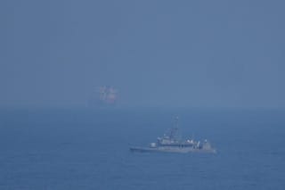 A UAE navy ship patrols the Strait of Hormuz as seen from Mina Al Fajer, United Arab Emirates, Wednesday, March 11, 2026. (AP Photo/Altaf Qadri)