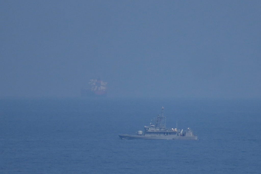 A UAE navy ship patrols the Strait of Hormuz as seen from Mina Al Fajer, United Arab Emirates, Wednesday, March 11, 2026. (AP Photo/Altaf Qadri)
