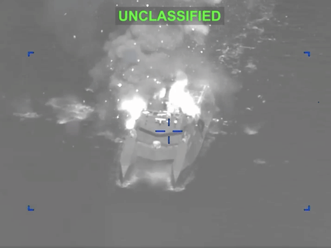 A screengrab from a video shared by the US Central Command showing an Iranian combat ship up in flames after being hit in a precision strike. American Admiral Brad Cooper said "strike waves" were carried out nearly every hour from different locations and directions going into Iran. 
